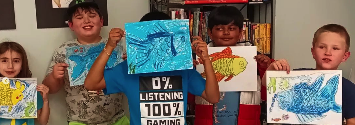 Happy Kids holding up their art